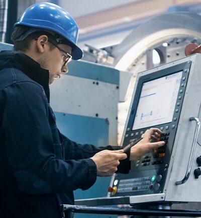 Front-line worker adjusting machine settings